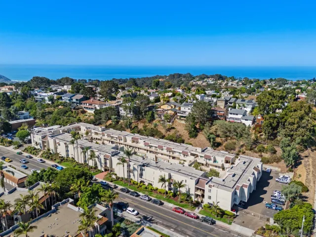 a view of a city with an ocean