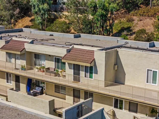 a view of a white building among the street