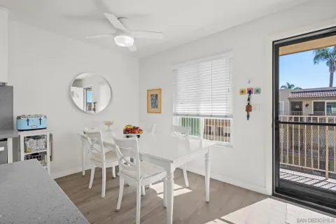 a view of a dining room with furniture and a window