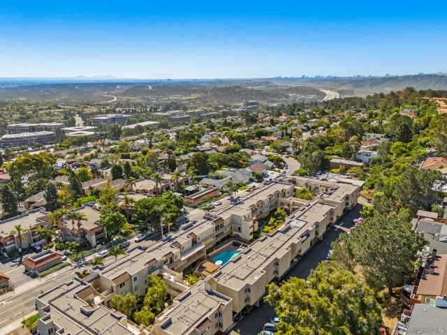 an aerial view of city and lake
