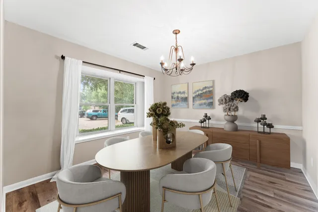 a dining room with furniture and window