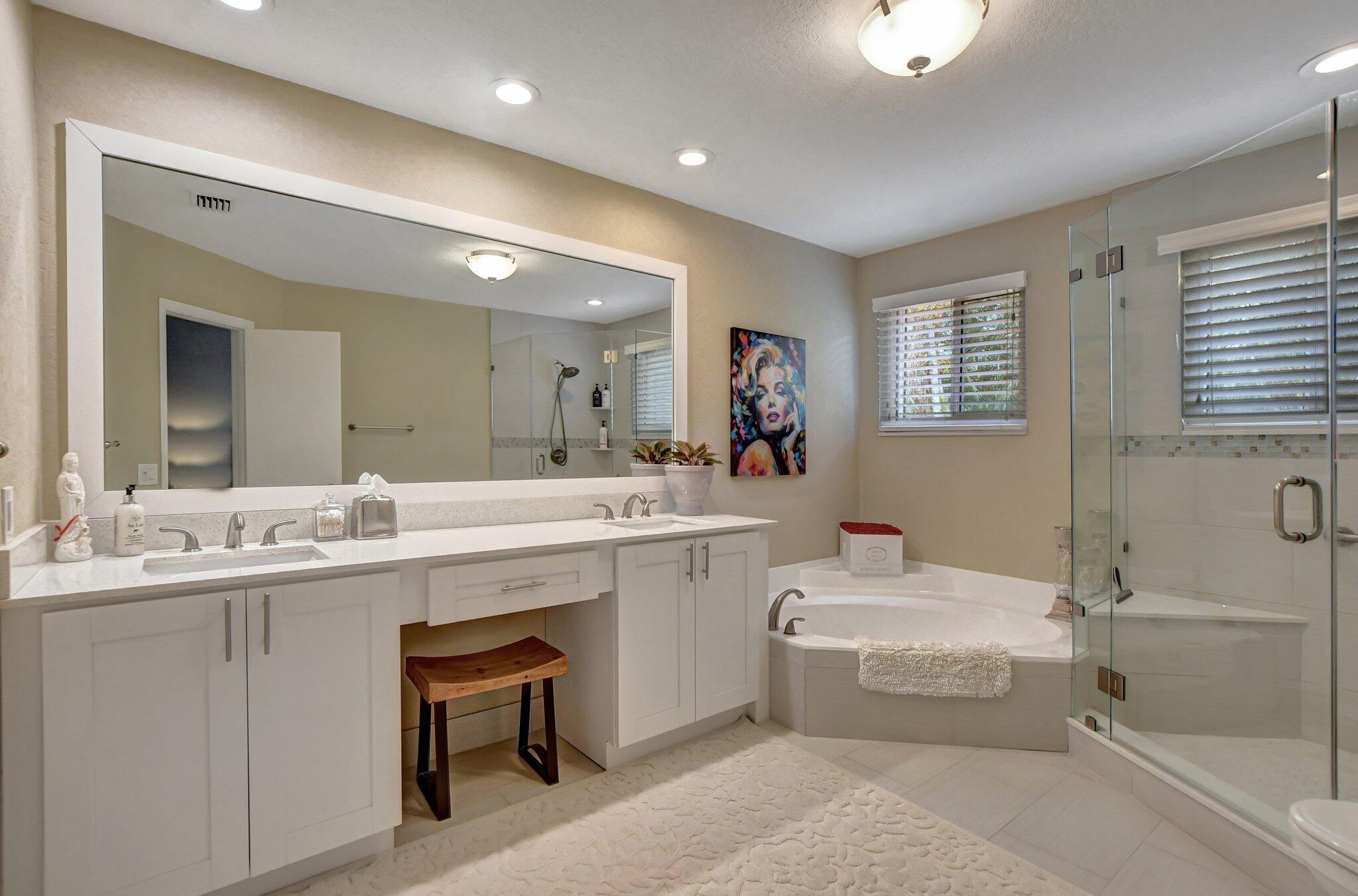 6682 Via Regina Boca Raton, FL 33433 - Photo 13 of 46 a bathroom with a sink double vanity granite tub shower and mirror