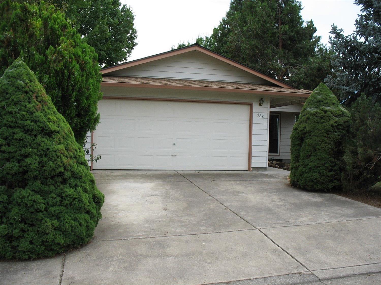 528 Bell Road Talent, OR 97540 - Photo 2 of 2 a house with trees in the background