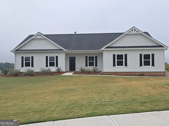 a house with swimming pool in front of it