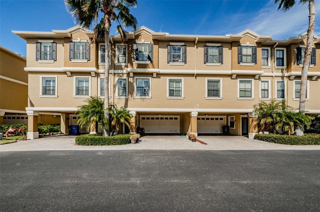613 Bella Loop, Unit 2 Dunedin, FL 34698 - Photo 1 of 1 Beautiful Mediterranean Front Exterior. Elevator spans from garage level to third level
