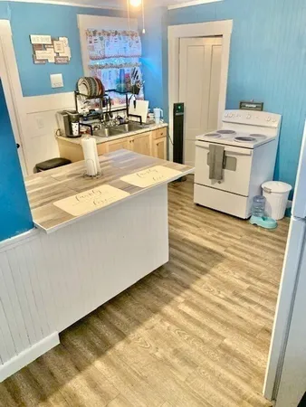 a kitchen with a stove and a refrigerator