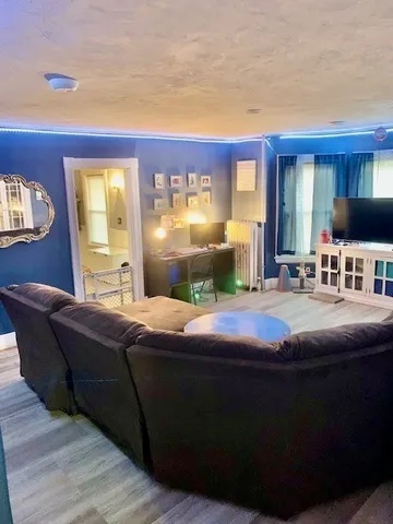 a living room with a couch and a large window