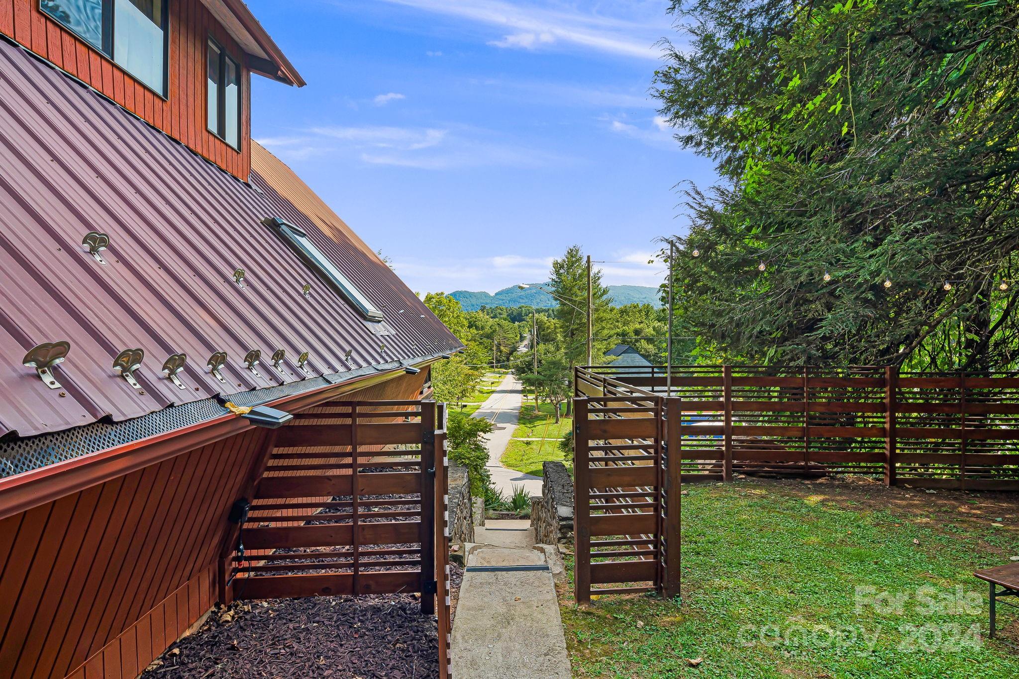 161 Spencer Street Clyde, NC 28721 - Photo 31 of 41 a view of a yard with stairs and a stairs