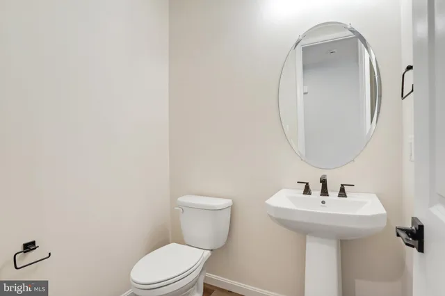 a view of kitchen with furniture and wooden floor
