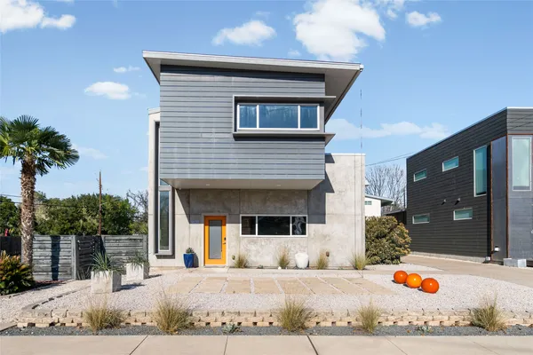 a front view of a house with a patio