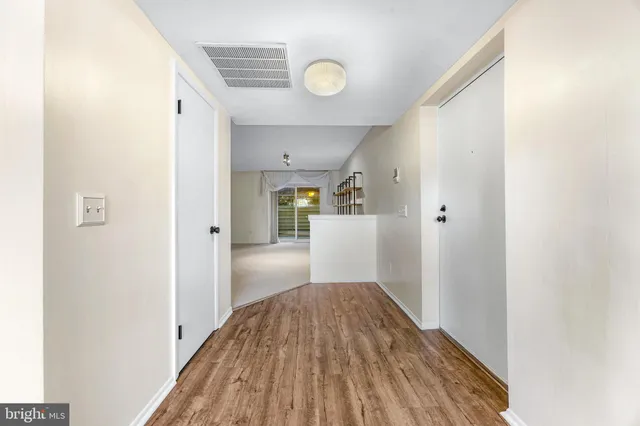 a view of a kitchen from the hallway