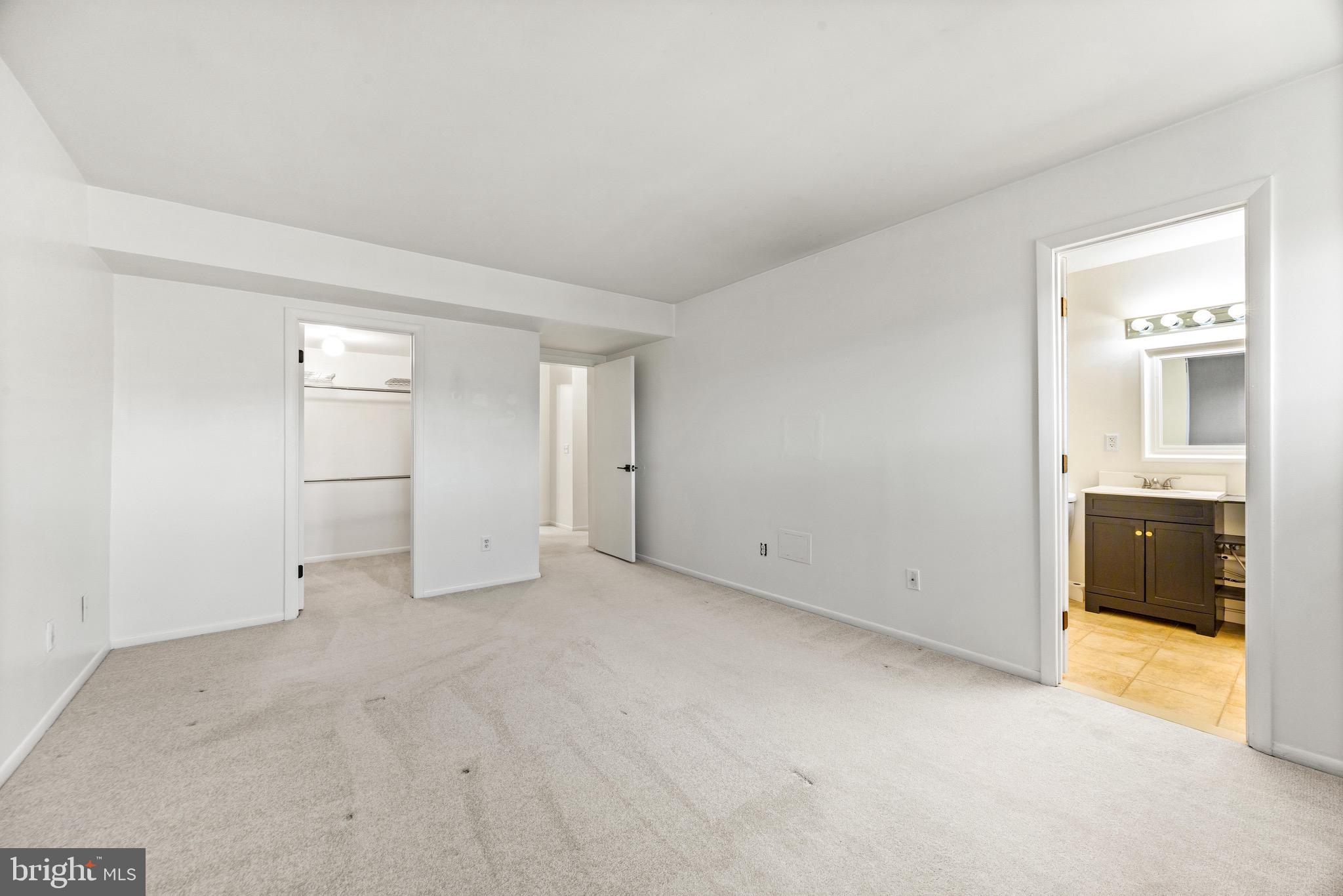 6909 Jones View Drive, Unit 1A Baltimore, MD 21209 - Photo 13 of 30 a view of an empty room with a window