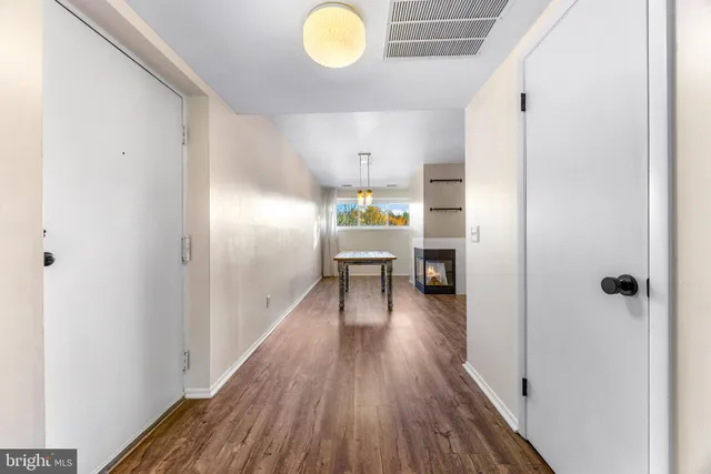 a view of a hallway view with wooden floor and staircase