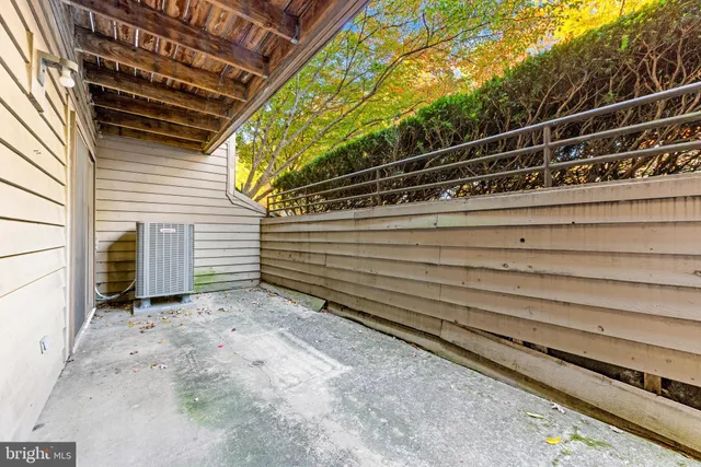 a view of a house with a wooden deck