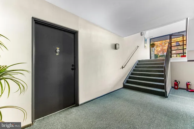 a view of entryway with stairs and furniture