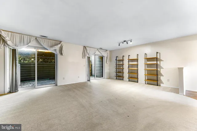 a view of an empty room with a garage