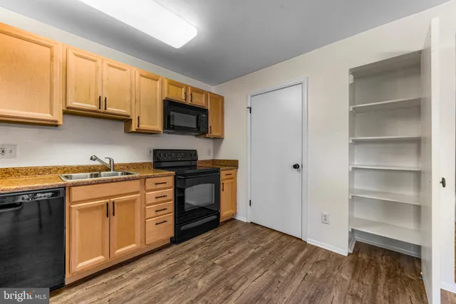 a kitchen with a refrigerator stove and a sink