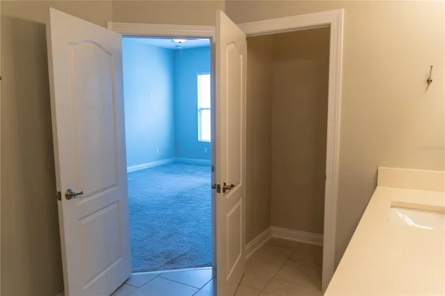a en suite bathroom with a sink and mirror