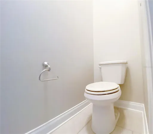 a bathroom with a sink mirror and toilet
