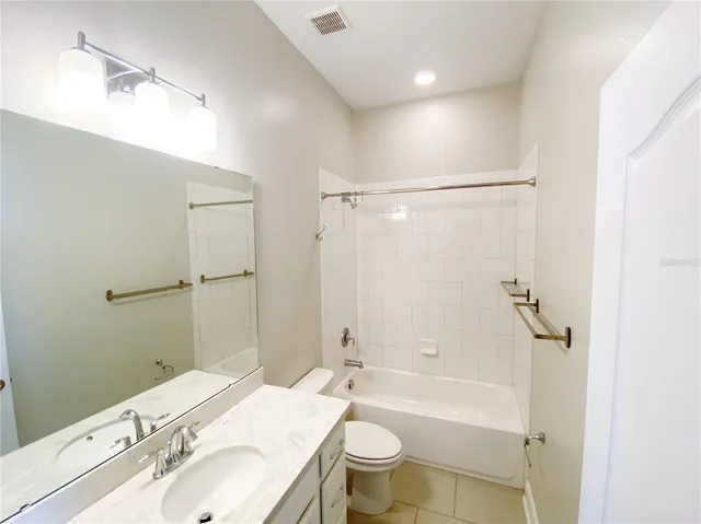 a bathroom with a toilet and a sink