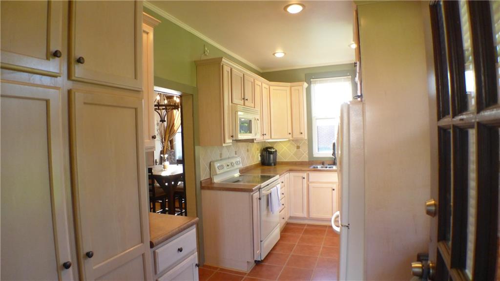 1097 Broughton Road Pittsburgh, PA 15236 - Photo 2 of 25 Suspected porch converted to this light & bright kitchen over the years!