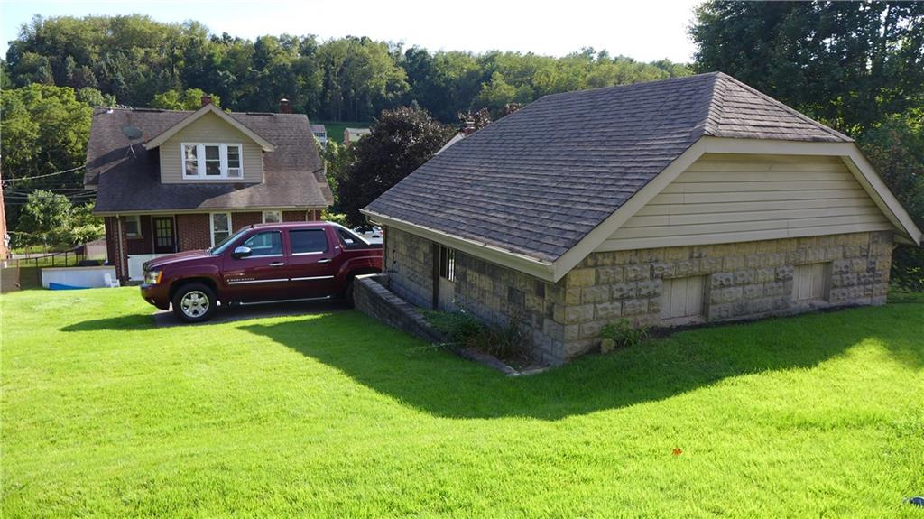 1097 Broughton Road Pittsburgh, PA 15236 - Photo 22 of 25 Detached garage swallowed up the the lush green yard.
