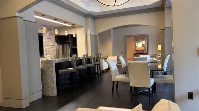 a bathroom with a granite countertop sink a mirror and a shower