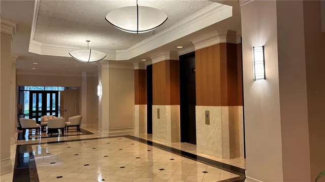 a vase of flowers sitting on a table with window