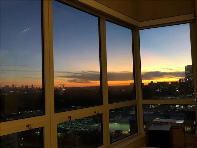a view of a balcony next to a yard