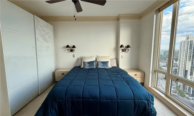 a view of a bedroom from the balcony