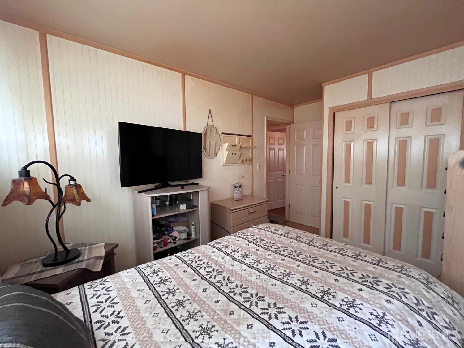 11 Purdue Road Old Bridge, NJ 08859 - Photo 11 of 14 a bedroom with a bed and a flat screen tv