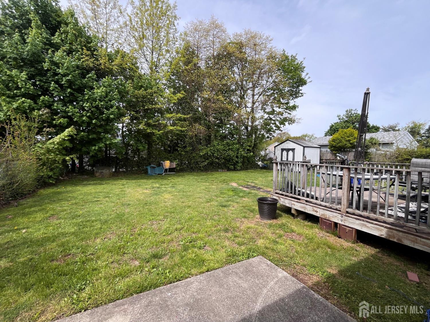 11 Purdue Road Old Bridge, NJ 08859 - Photo 2 of 14 a view of a wooden deck with a yard