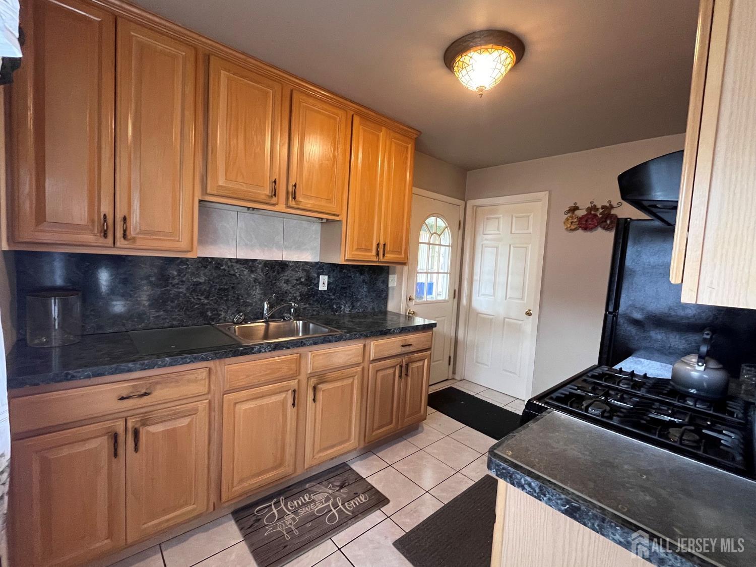 11 Purdue Road Old Bridge, NJ 08859 - Photo 4 of 14 a kitchen with granite countertop stainless steel appliances a stove sink and cabinets