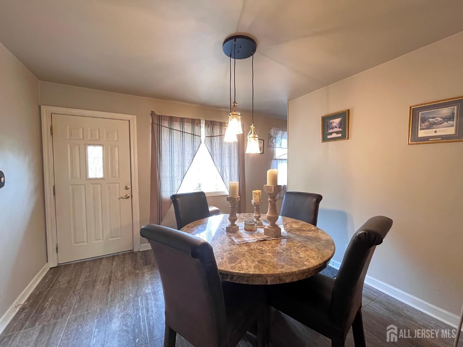 11 Purdue Road Old Bridge, NJ 08859 - Photo 5 of 14 a dining room with furniture a chandelier and window