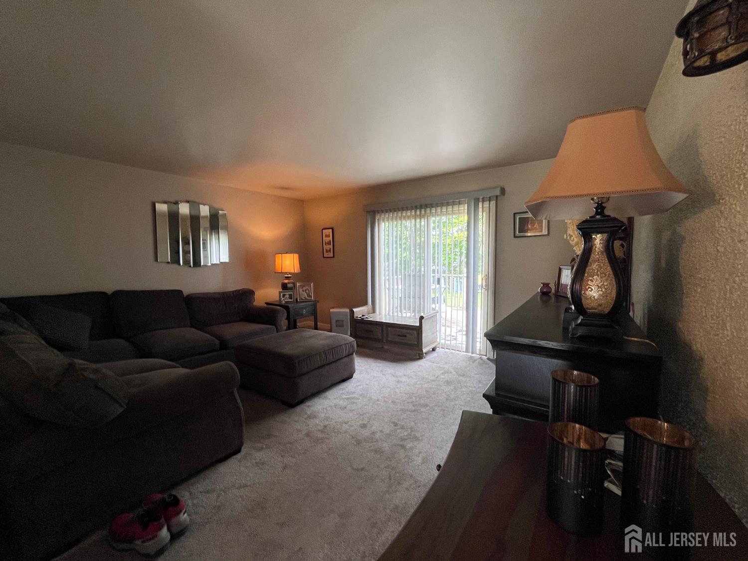 11 Purdue Road Old Bridge, NJ 08859 - Photo 7 of 14 a living room with furniture a lamp and a window