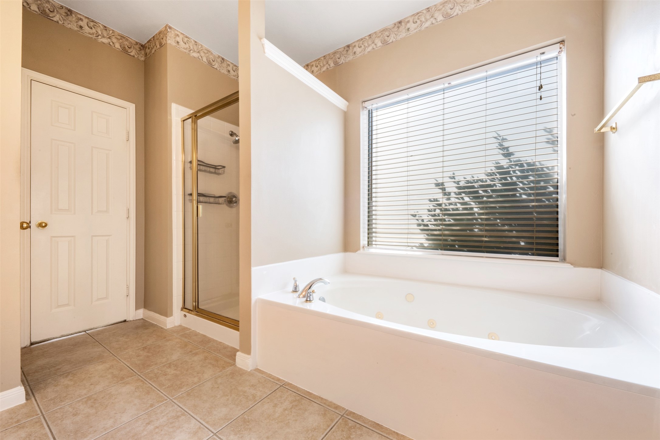 7023 Timber Edge Lane Humble, TX 77346 - Photo 16 of 37 a bathroom with bathtub and shower