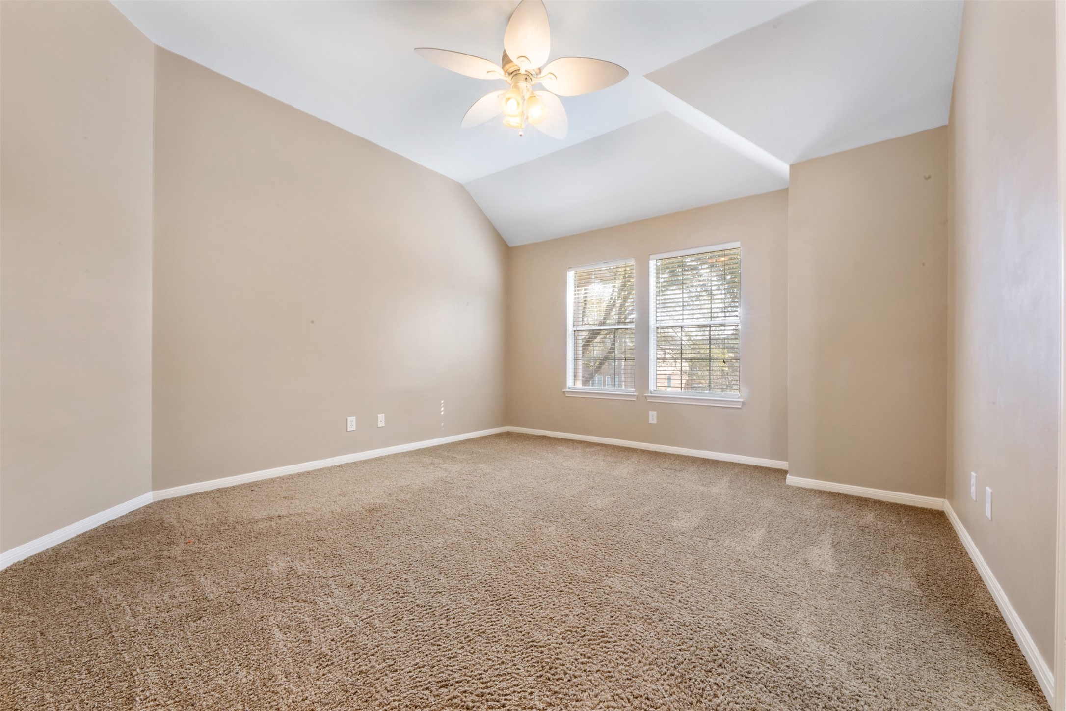 7023 Timber Edge Lane Humble, TX 77346 - Photo 18 of 37 an empty room with a window and a ceiling fan