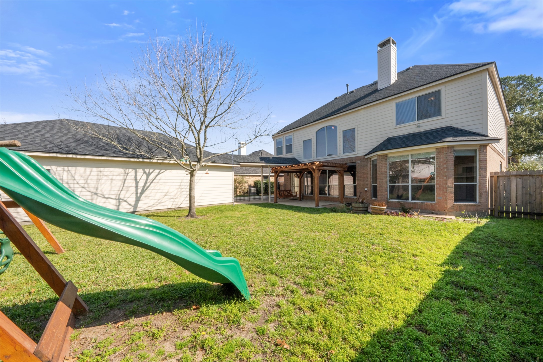 7023 Timber Edge Lane Humble, TX 77346 - Photo 26 of 37 a front view of a house with a yard table and chairs