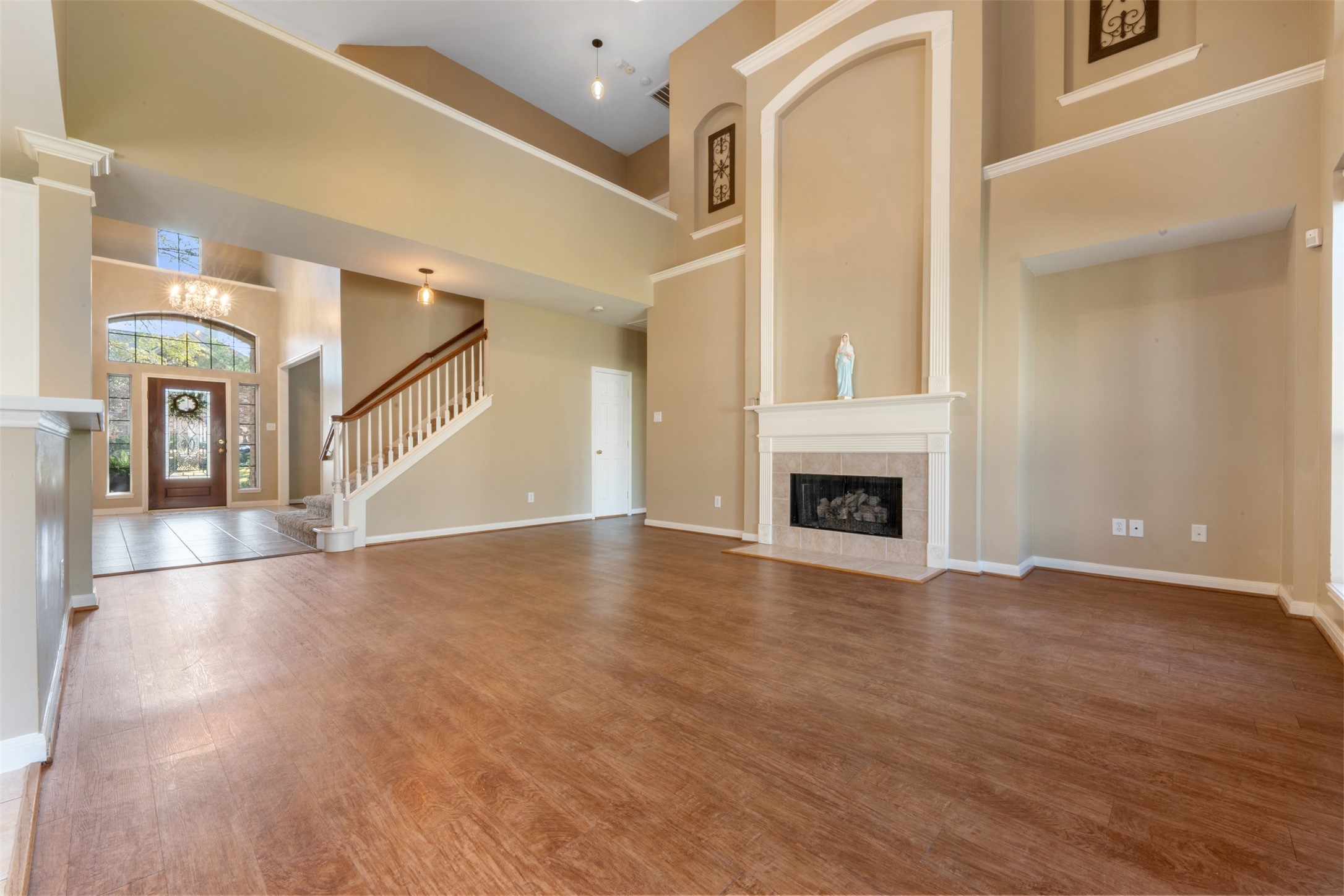 7023 Timber Edge Lane Humble, TX 77346 - Photo 5 of 37 a view of a livingroom with wooden floor and a fireplace