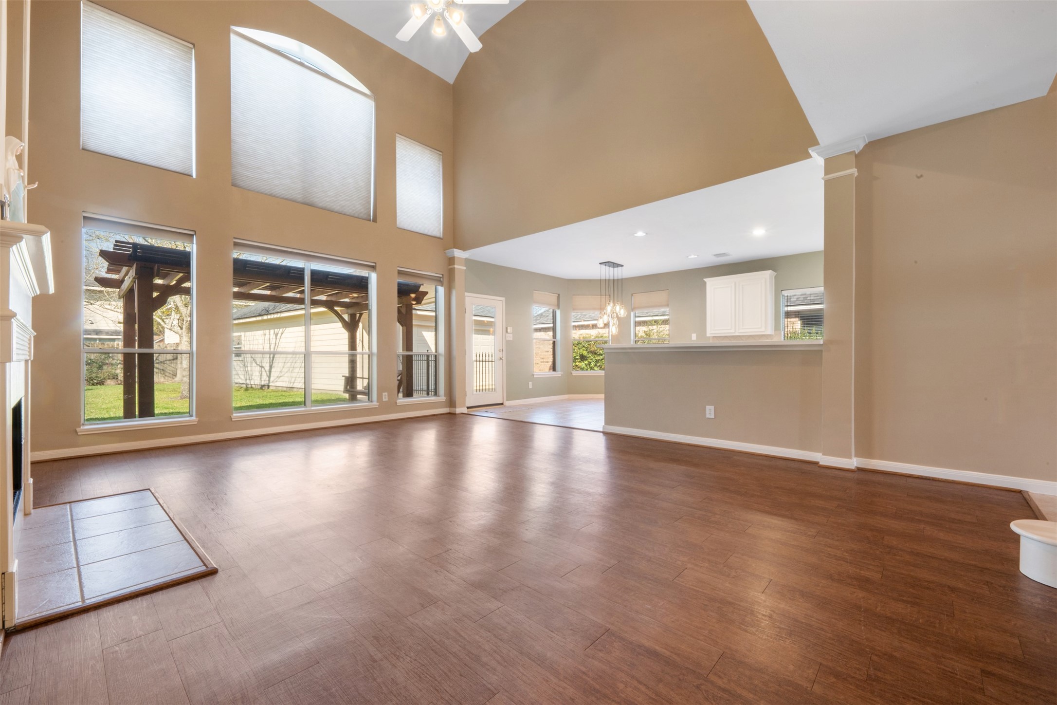 7023 Timber Edge Lane Humble, TX 77346 - Photo 7 of 37 an empty room with wooden floor and windows
