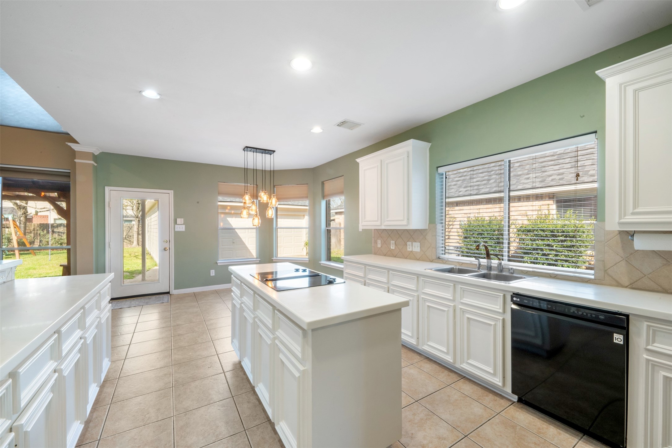 7023 Timber Edge Lane Humble, TX 77346 - Photo 9 of 37 a kitchen with a sink stove and cabinets