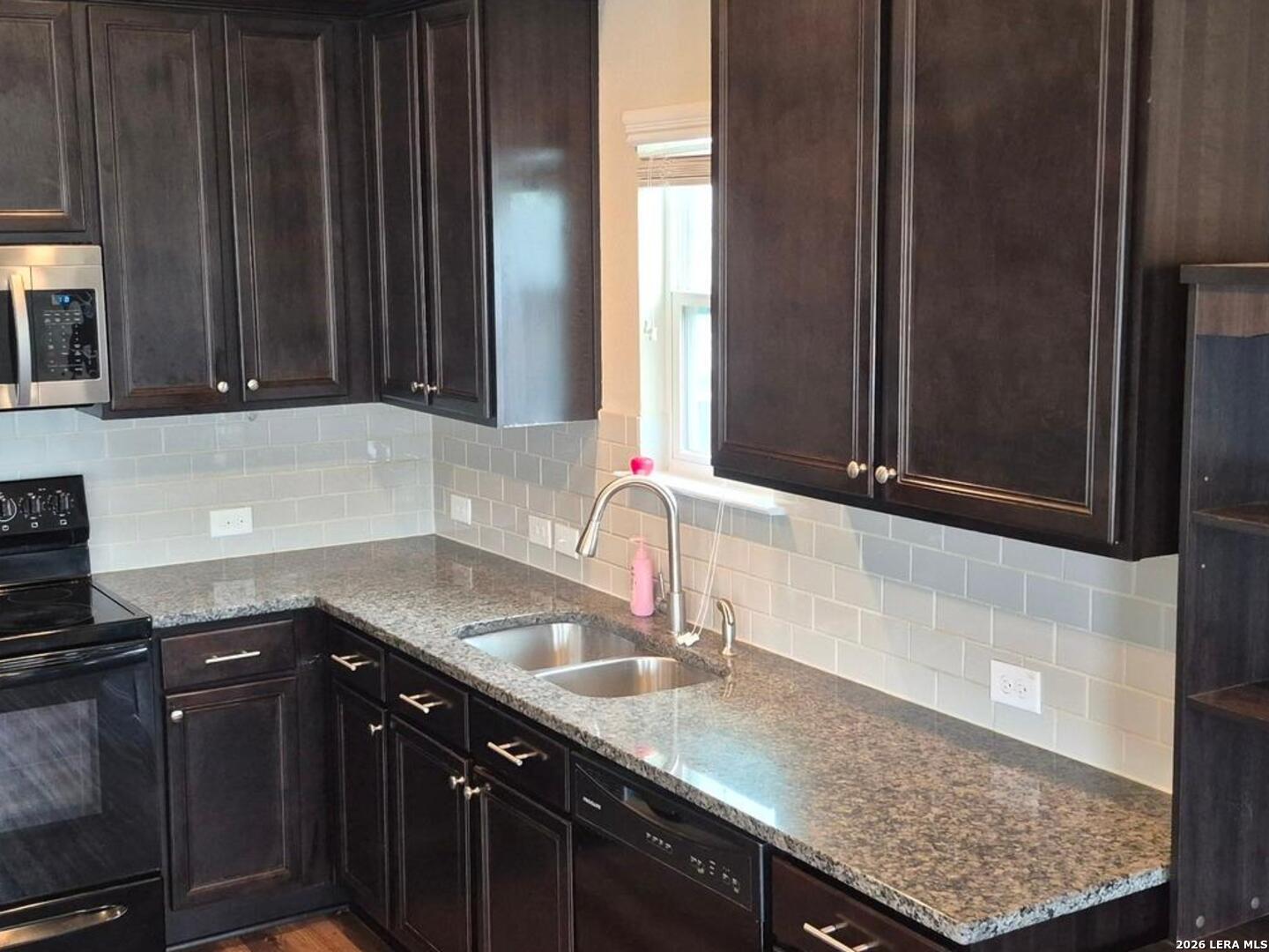 7102 Zuma Beach Converse, TX 78109 - Photo 13 of 31 a kitchen with granite countertop a sink and a stove