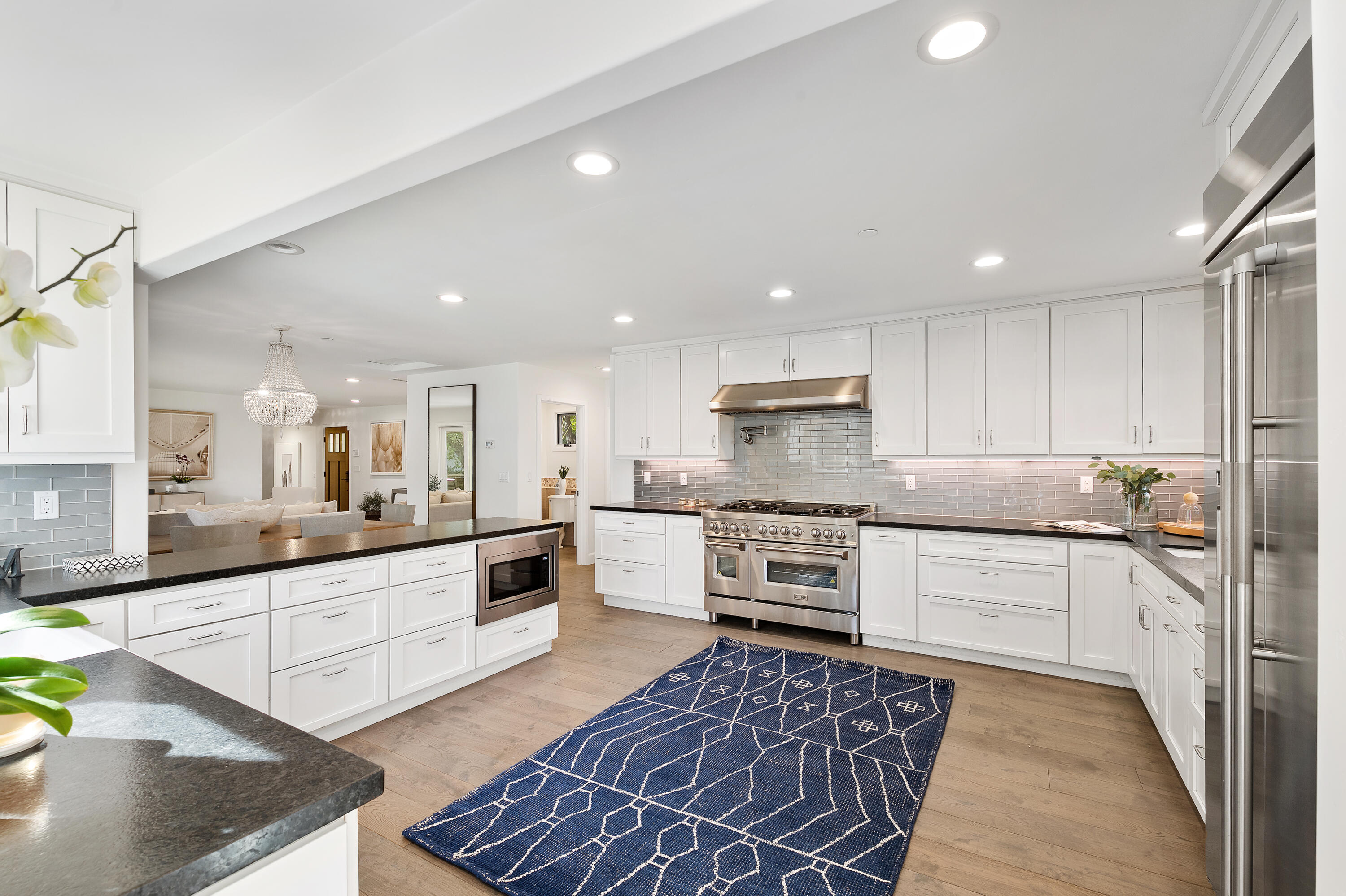104 La Vereda Road Montecito, CA 93108 - Photo 3 of 15 a large kitchen with stainless steel appliances lots of counter space and a sink