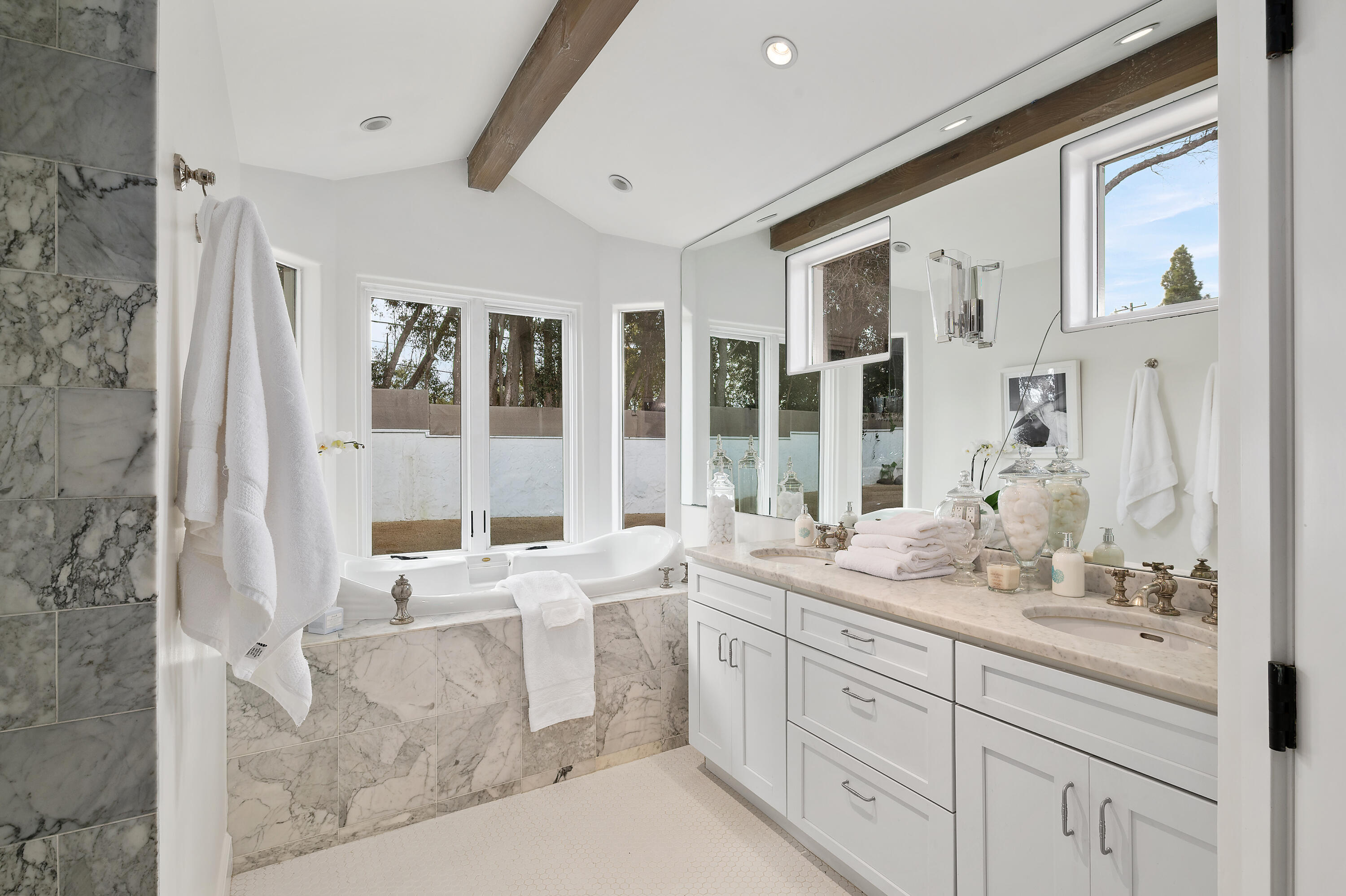104 La Vereda Road Montecito, CA 93108 - Photo 8 of 15 a bathroom with a granite countertop sink mirror and a bathtub