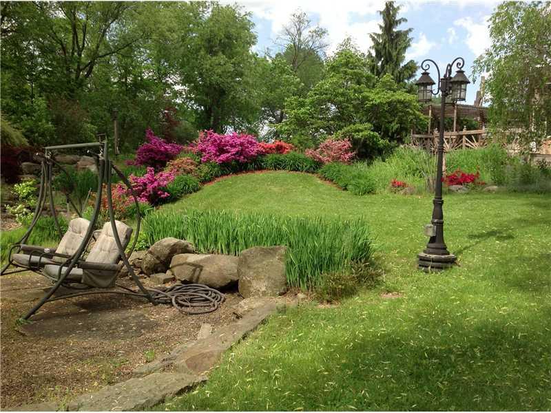 4045 Hillsville Road Pulaski, PA 16143 - Photo 5 of 23 Exterior Back. Flowers in full bloom