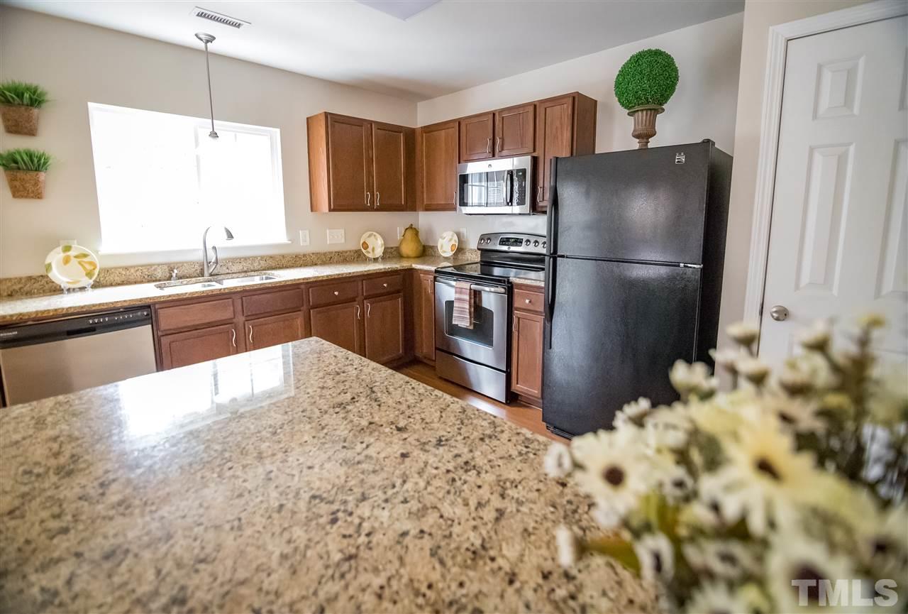 Kitchen has Window above Sink and offers Granite Counter Tops and Newer Appliances