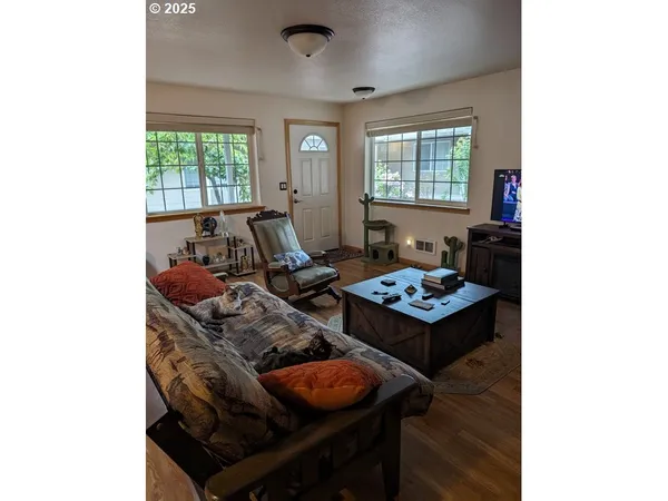 a living room with furniture and a window