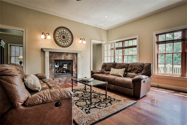 170 Central Avenue Needham, MA 02494 - Photo 11 of 30 a living room with furniture a clock and a fireplace