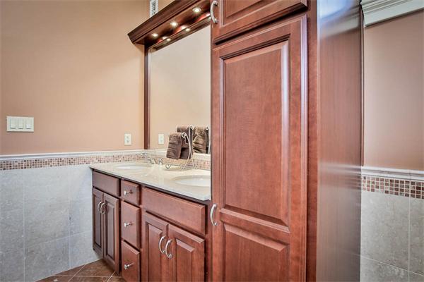 170 Central Avenue Needham, MA 02494 - Photo 19 of 30 a bathroom with a granite countertop sink and washing machine