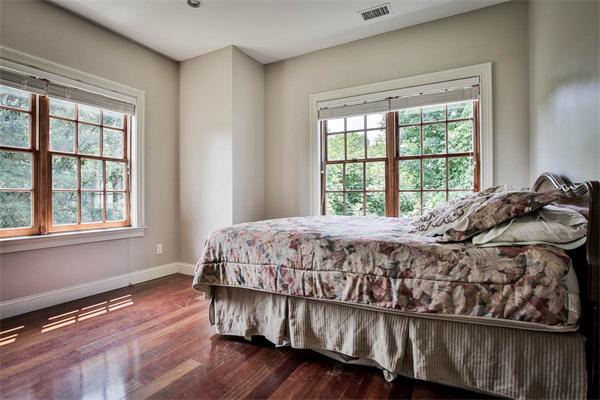 170 Central Avenue Needham, MA 02494 - Photo 23 of 30 a bed sitting in a bedroom next to a window